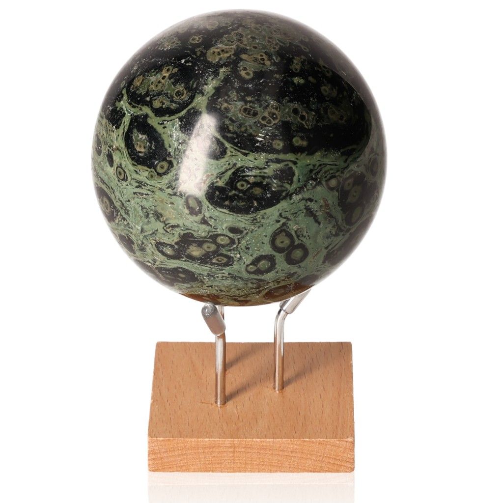 Kambaba Jasper Sphere on stand, showcasing its green and black patterns, known for promoting peace and emotional stability.