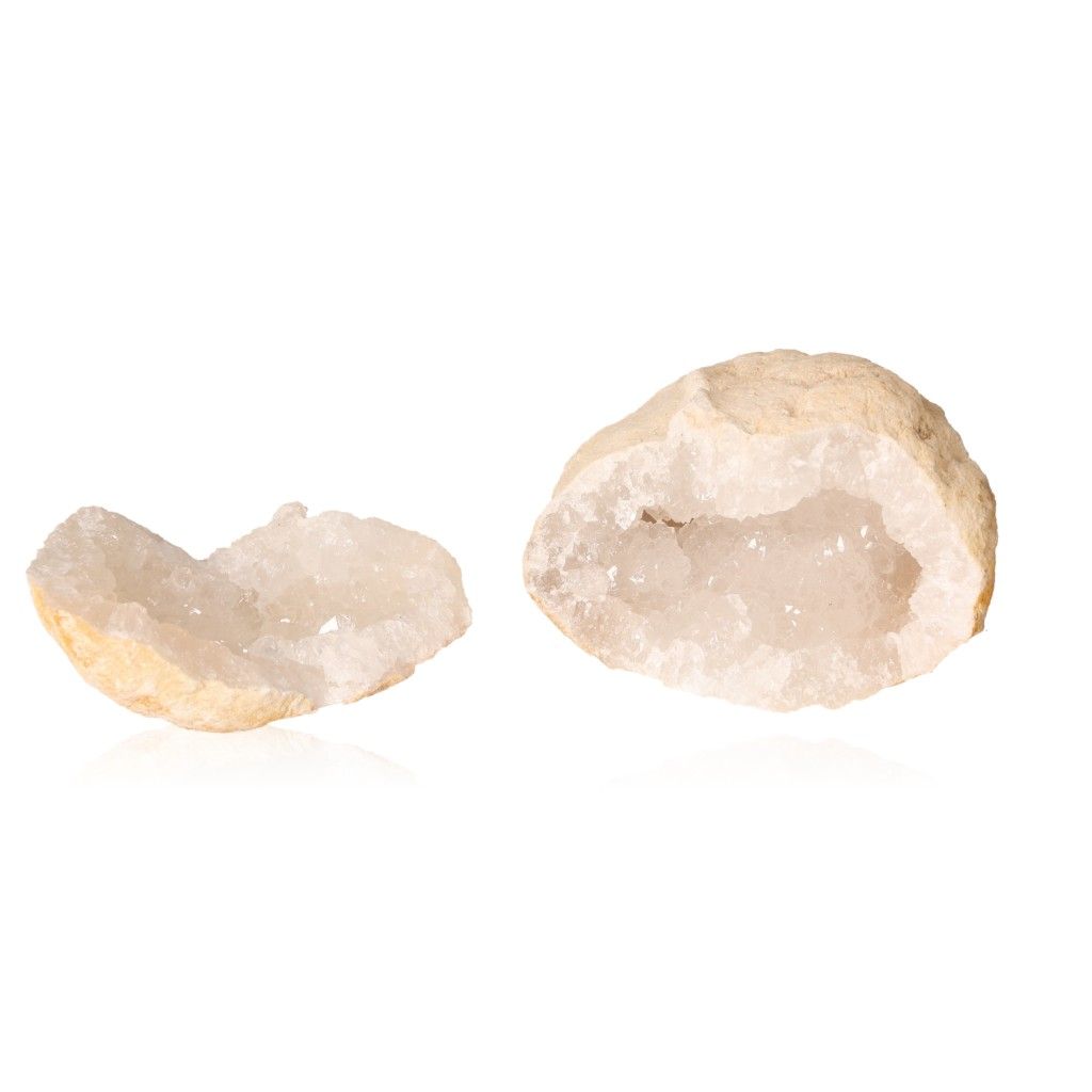 Milky quartz geode with rugged shell and sparkling white crystals for energy purification and tranquility.