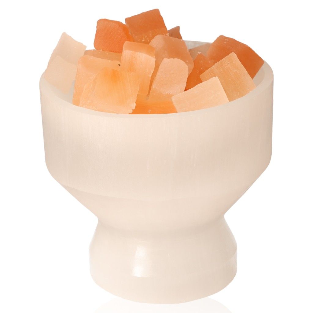 Selenite bowl with Himalayan salt chunks for home décor and wellness.