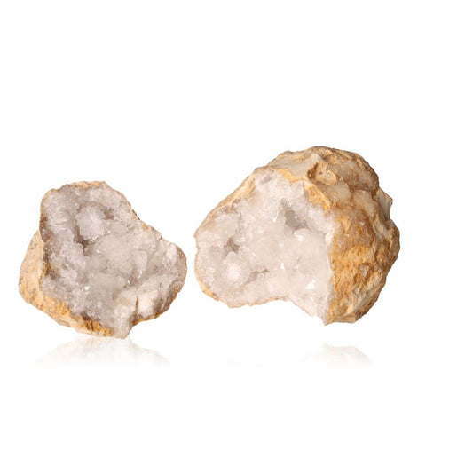 Milky quartz geodes with sparkling white crystals and earthy shell, perfect for purifying energy and enhancing tranquility.