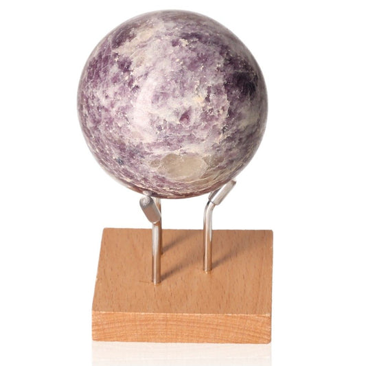 Lepidolite sphere on wooden stand promotes peace and emotional balance with soothing, anxiety-relieving energy.