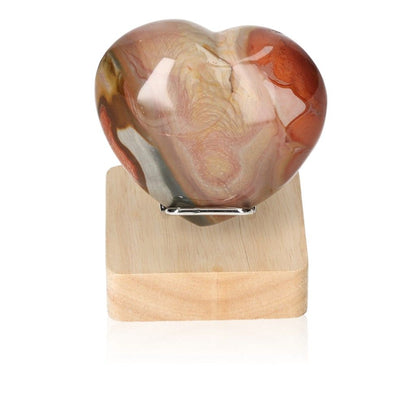 Polychrome Jasper Heart with vibrant colors on display stand, known for grounding and energizing properties.