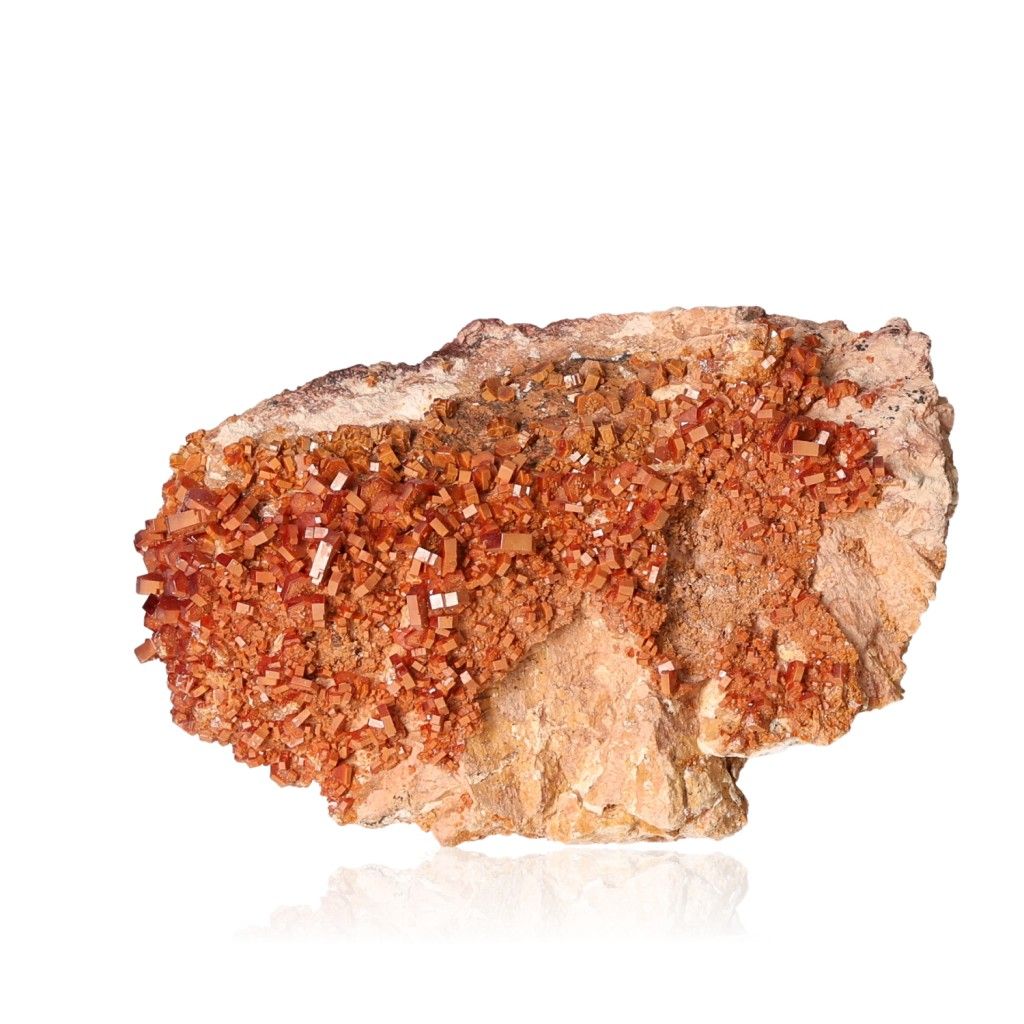 Vanadinite Druze with reddish-orange hexagonal crystals on rock, known for enhancing focus and motivation.