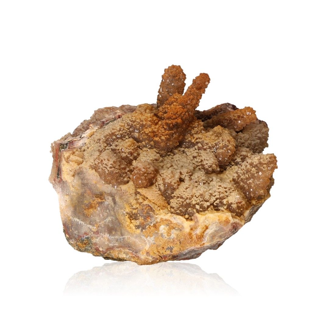 Calcite stalactite formation showcasing layered earthy tones and natural growth, symbolizing energy and transformation.