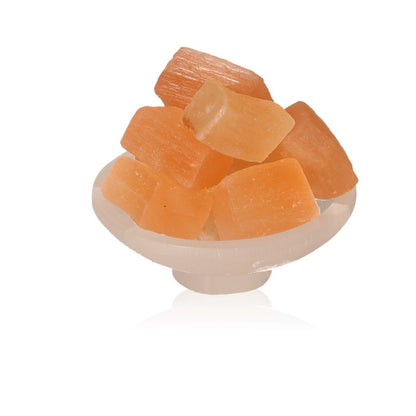 Selenite bowl stand with rough orange crystals for spiritual growth by Sylvia Crystals