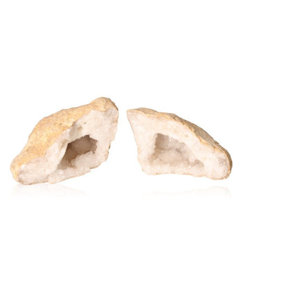 Rugged outer shell of milky quartz geode revealing sparkling cloudy white crystals, known for energizing and purifying properties.