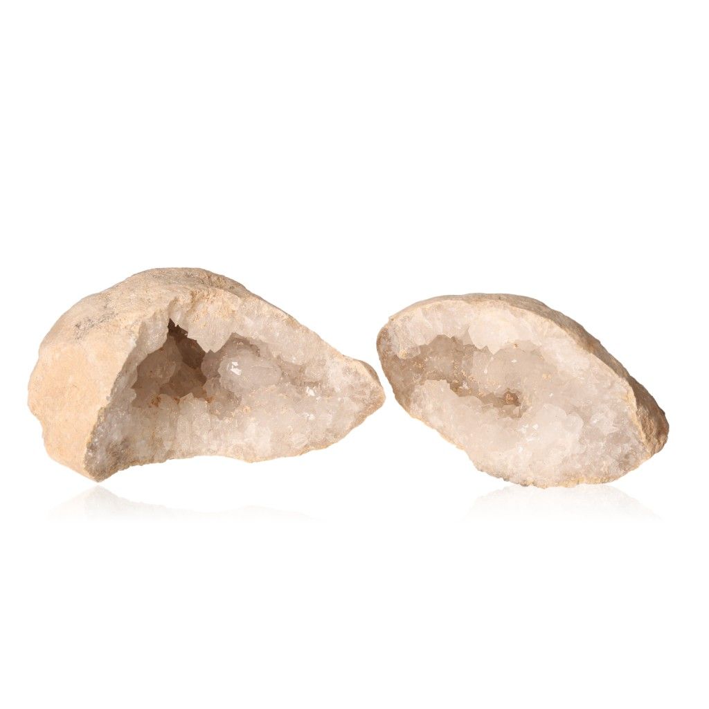 Milky quartz geodes showcasing rugged exterior and sparkling white crystals, ideal for cleansing spaces and enhancing tranquility.