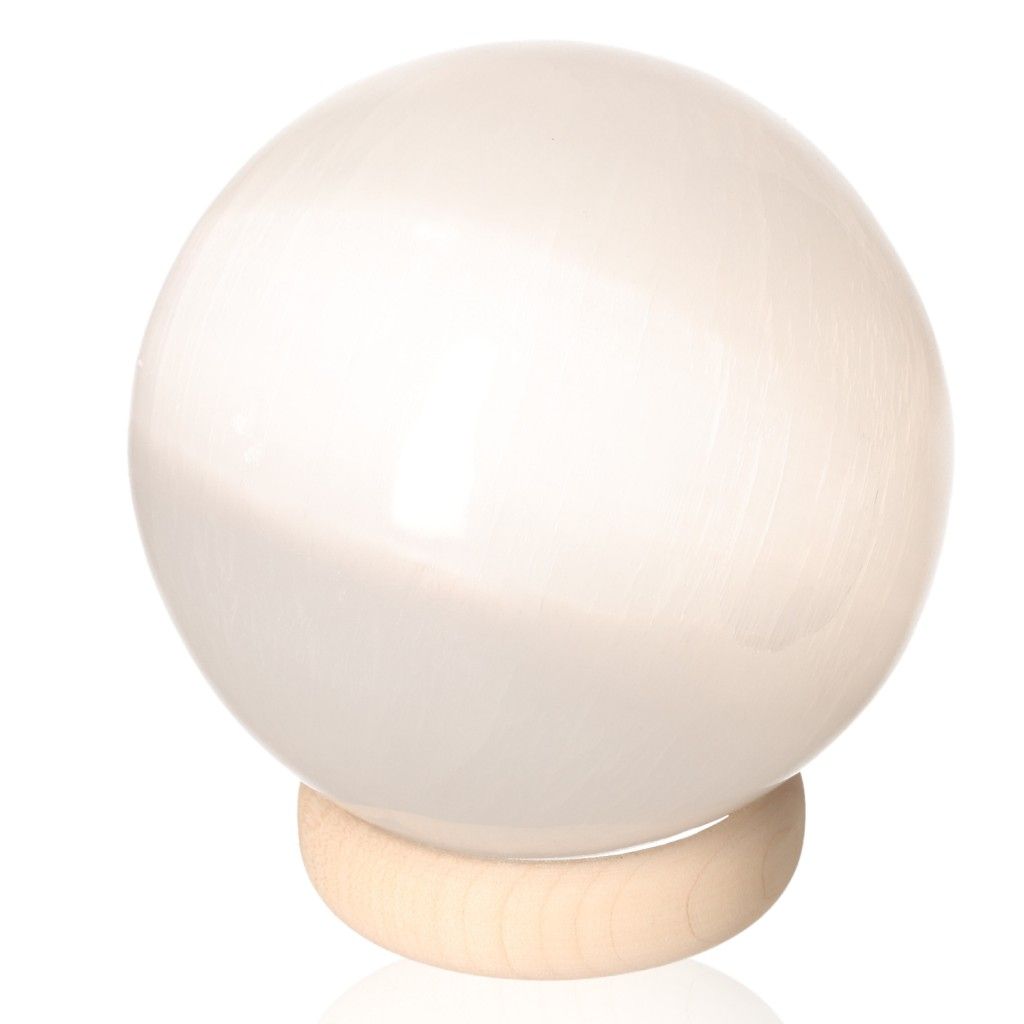 Selenite sphere on wooden stand, premium 10cm crystal from Sylvia Crystals for mindfulness and spiritual growth.