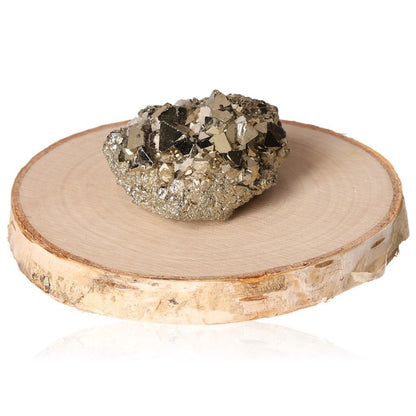 Pyrite druze crystal on a wooden slab, promoting independence, courage, and motivation for personal growth and goal achievement.