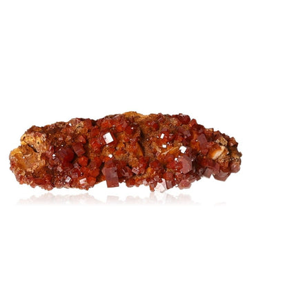 Vanadinite Druze with vibrant reddish-brown hexagonal crystals on a glassy surface, known for enhancing focus and motivation.