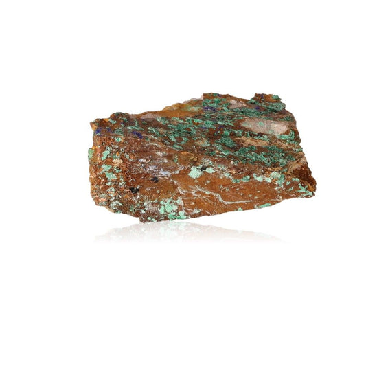 Raw malachite druze stone showcasing natural textures and vibrant green hues on a white background.