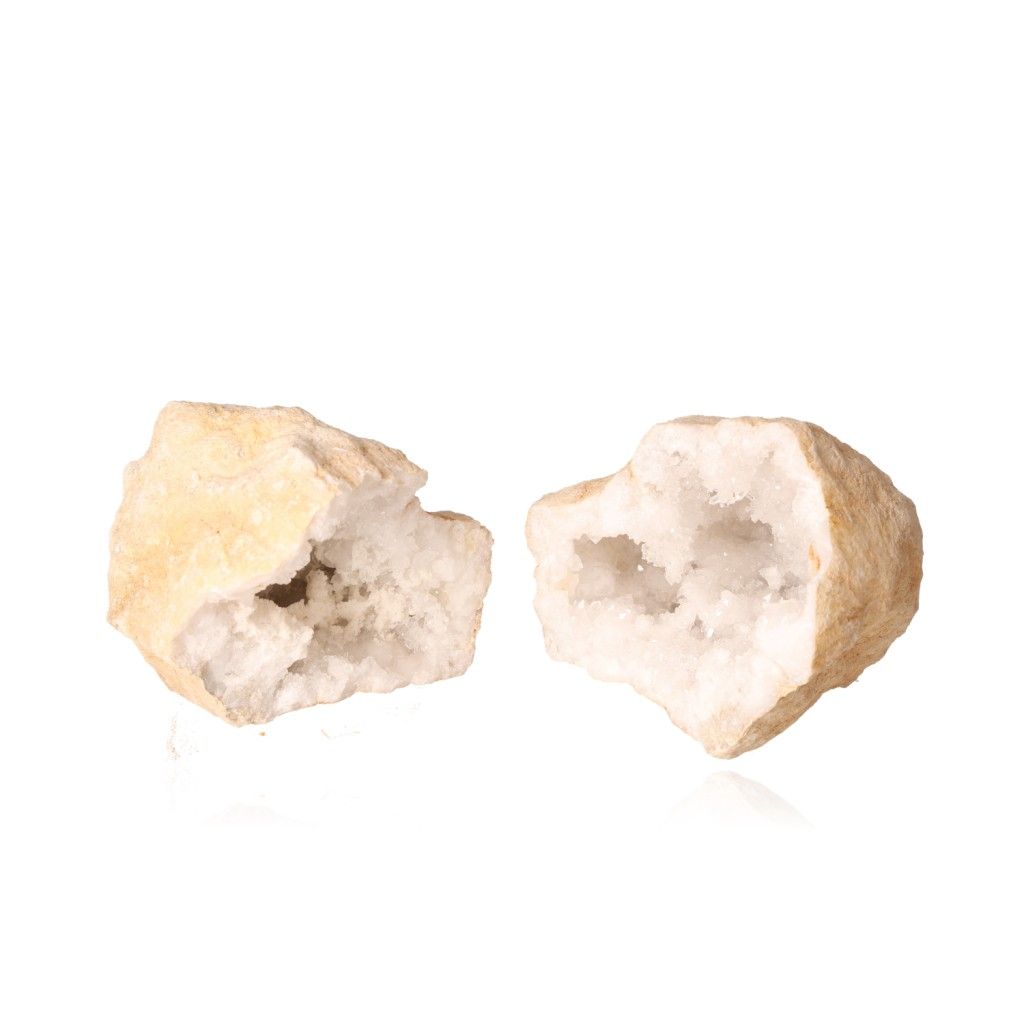 Milky quartz geode split open revealing sparkling white crystals, promoting energy balance and inner strength.