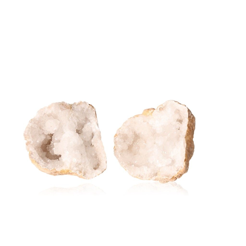 Milky quartz geode with rugged shell and sparkling white crystals, enhancing tranquility and positive energy.