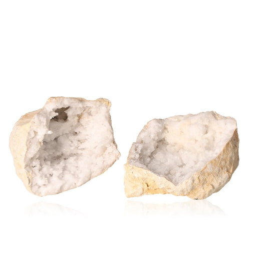 Milky quartz geodes with rugged shell and sparkling white crystals, enhancing tranquility and energy balance.