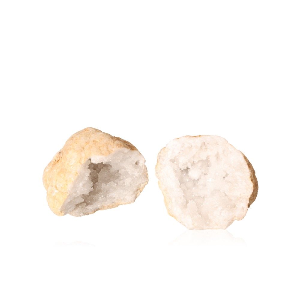 Opened quartz geode displaying sparkling cloudy white crystals against a rough earthy shell, enhancing clarity and positive energy.