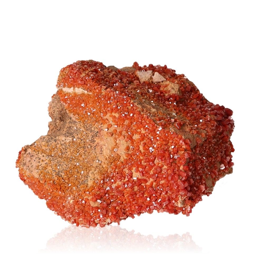 Vanadinite druzy stone enhances focus and motivation with vibrant red crystals for personal transformation and resilience.