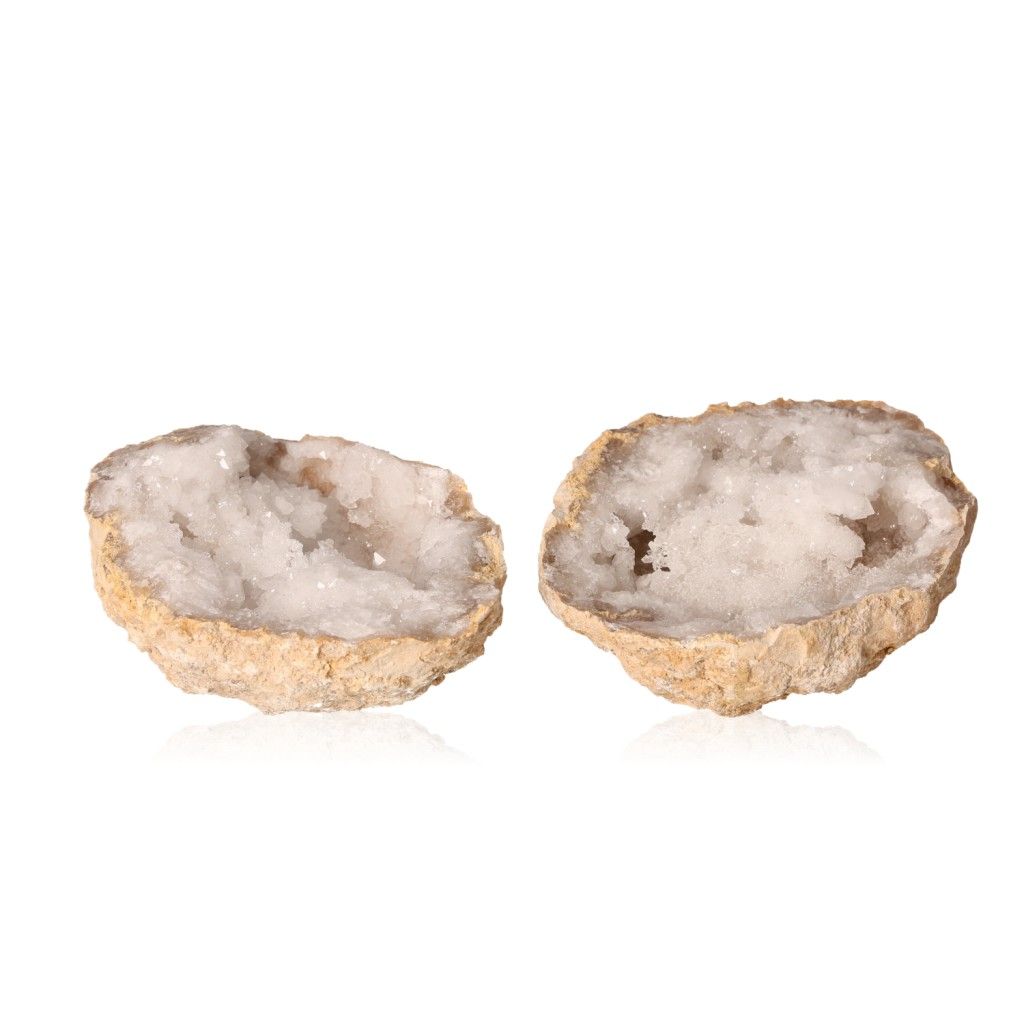 Quartz geode with milky white crystals and rough exterior, showcasing tranquility and purifying energy for enhanced focus and clarity.