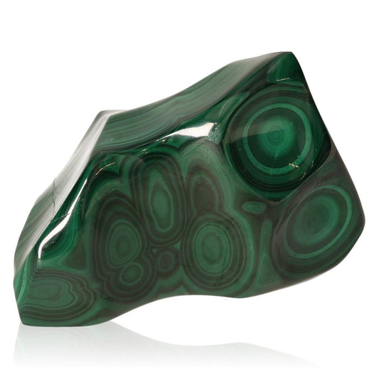 Polished green malachite stone with natural swirling patterns, known for its soothing energy and support in finding inner harmony.