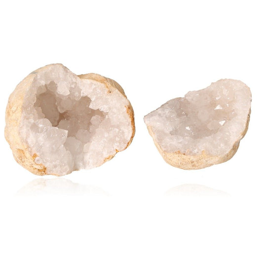 Milky quartz geode split open showing sparkling white crystals and rugged earthy shell.