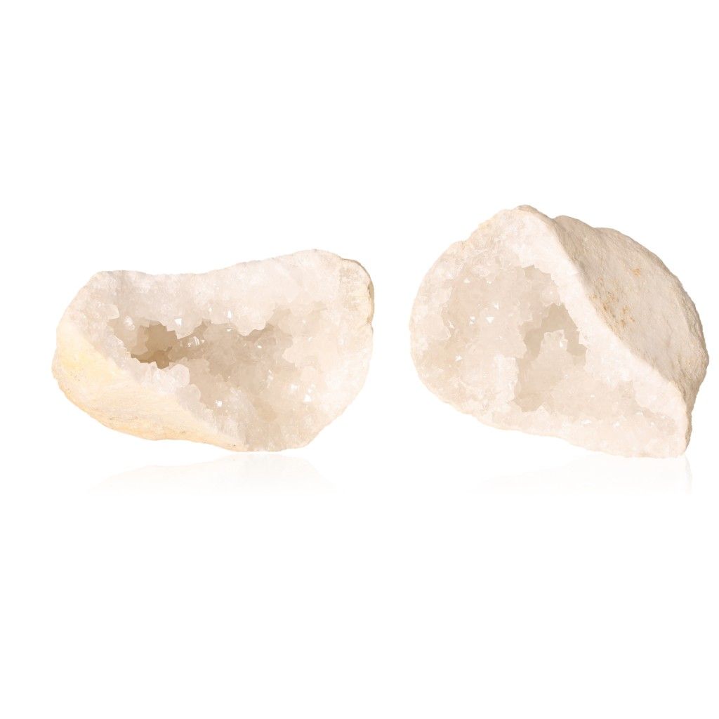 Milky quartz geode with sparkling white crystals and rugged exterior, known for purifying energy and enhancing tranquility.