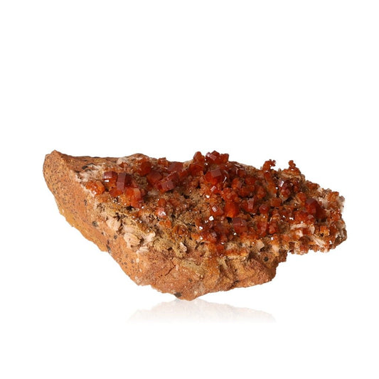 Vanadinite Druze with vibrant hexagonal crystals and reddish-brown hues, enhances focus and motivation.