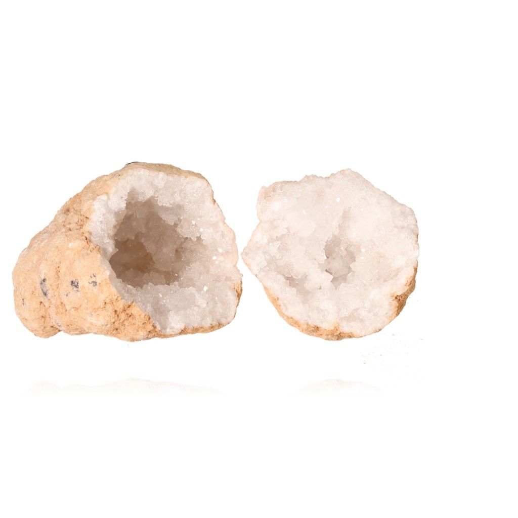 Milky quartz geode with rugged shell and sparkling white crystals, known for purifying energy and enhancing tranquility.