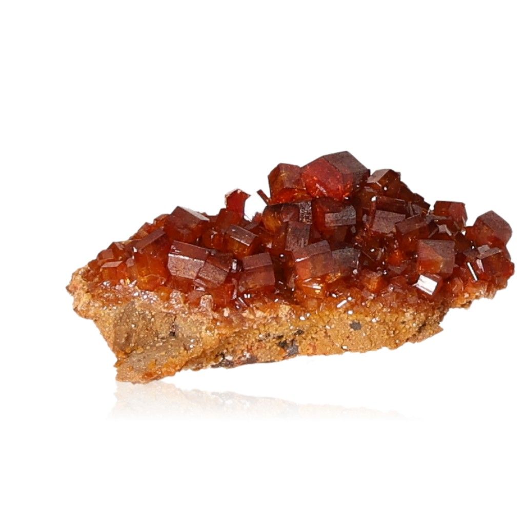 Vanadinite druze with vibrant reddish-brown hexagonal crystals and glassy surface, enhancing focus and motivation.