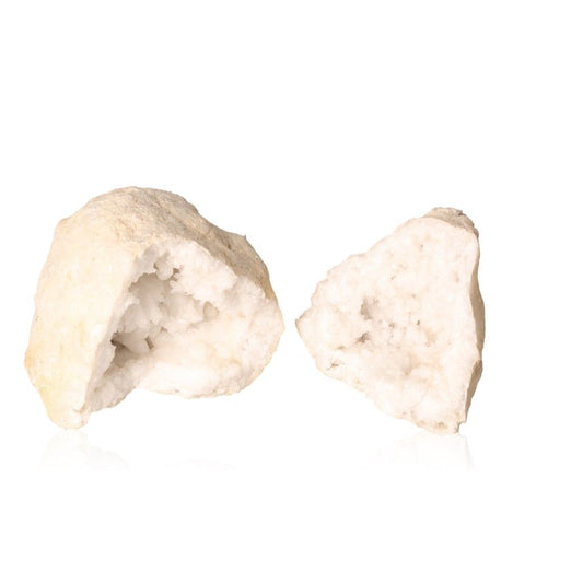 Milky quartz geode halves revealing sparkling white crystals, known for purifying energy and enhancing clarity and tranquility.