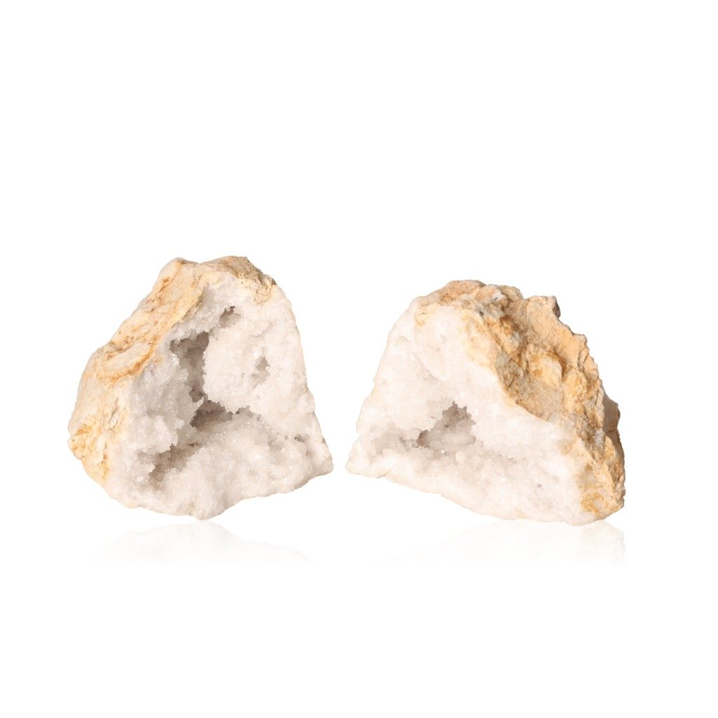 Milky quartz geode open to reveal sparkling white crystals, perfect for energy balance and promoting tranquility and clarity.