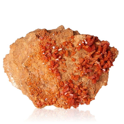 Vanadinite druze crystal stone for focus and motivation on white background.