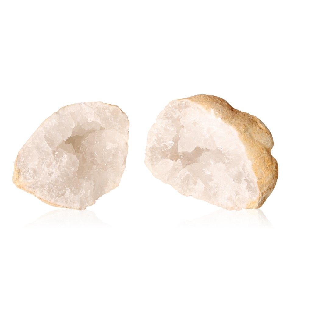 Milky quartz geode split open showing sparkling cloudy white crystals inside and a rugged outer shell.