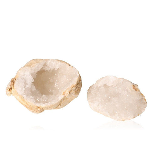 Milky quartz geode displaying rugged shell and sparkling white crystals, known for purifying energy and enhancing tranquility.