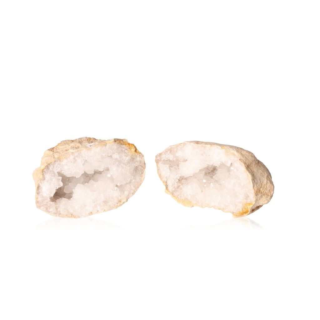 Milky quartz geodes with sparkling white crystals for energy cleansing and tranquility.