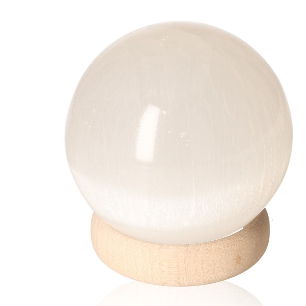 Selenite sphere 10cm on wooden stand by Sylvia Crystals for spiritual growth and mindful living