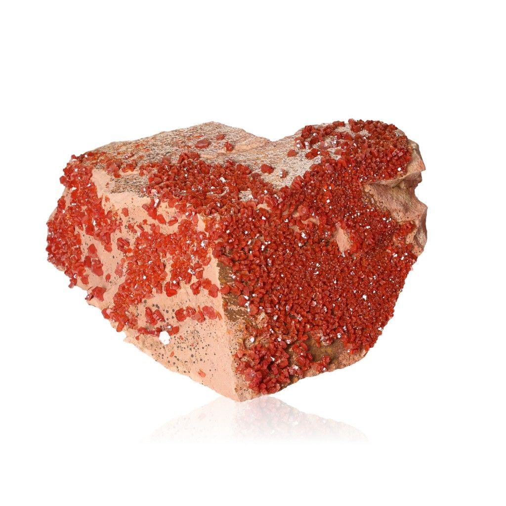 Vanadinite Druze with vibrant hexagonal crystals in bold reddish-orange hues, showcasing a glassy surface and geometric beauty.