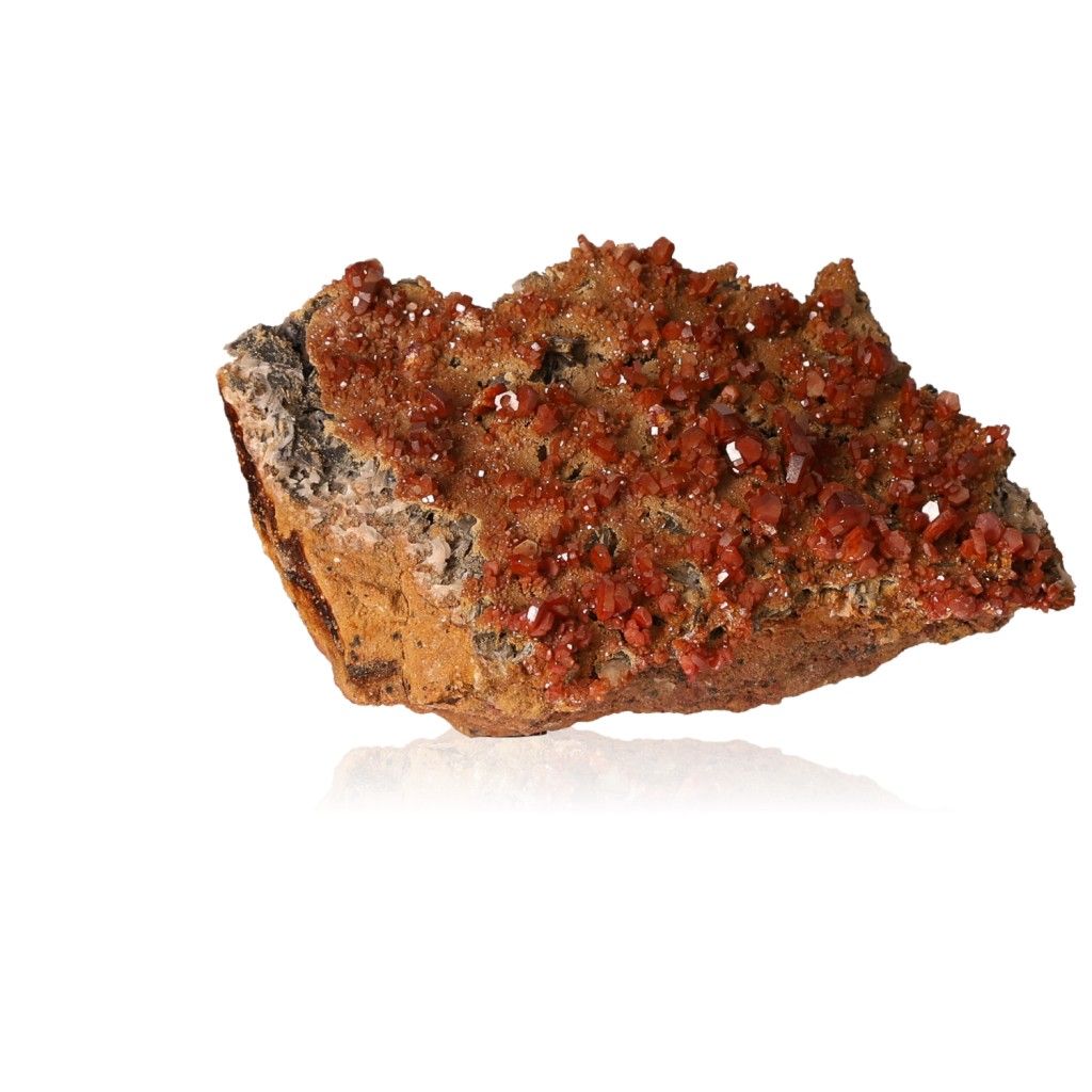 Vanadinite Druze with vibrant reddish hexagonal crystals enhancing focus and motivation on a glassy surface.