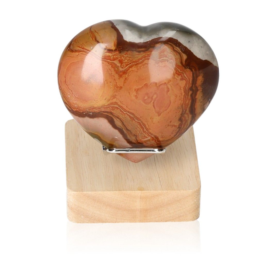 Polychrome Jasper Heart on wooden stand showcasing vibrant red and brown color patterns for grounding and energizing properties.