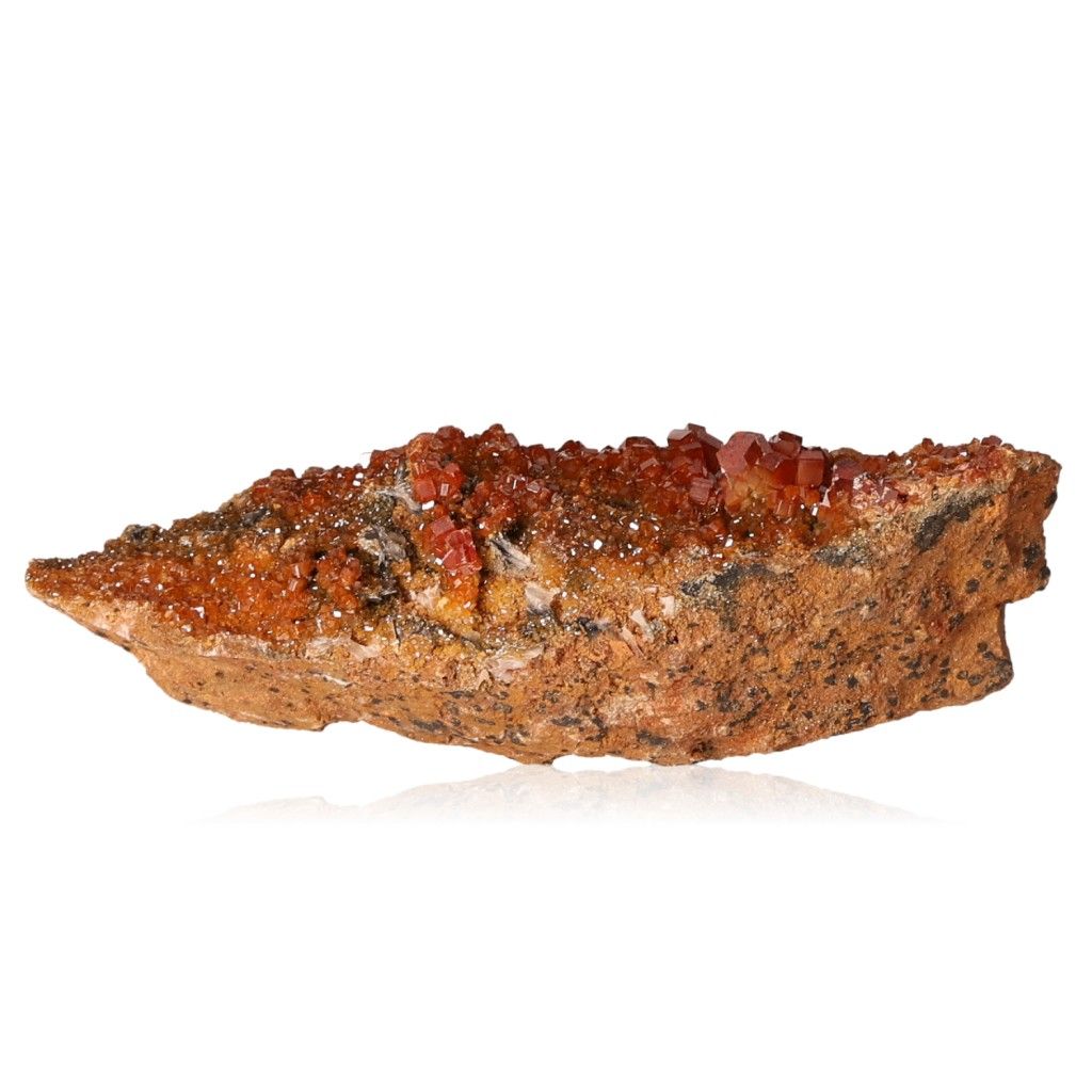 Vanadinite Druze with reddish-brown hexagonal crystals on a glassy surface, enhancing focus and motivation with vibrant hues.