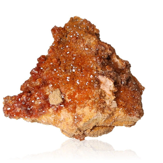 Vanadinite Druze with hexagonal crystals and glassy surface in reddish-brown and orange hues, enhancing focus and motivation.