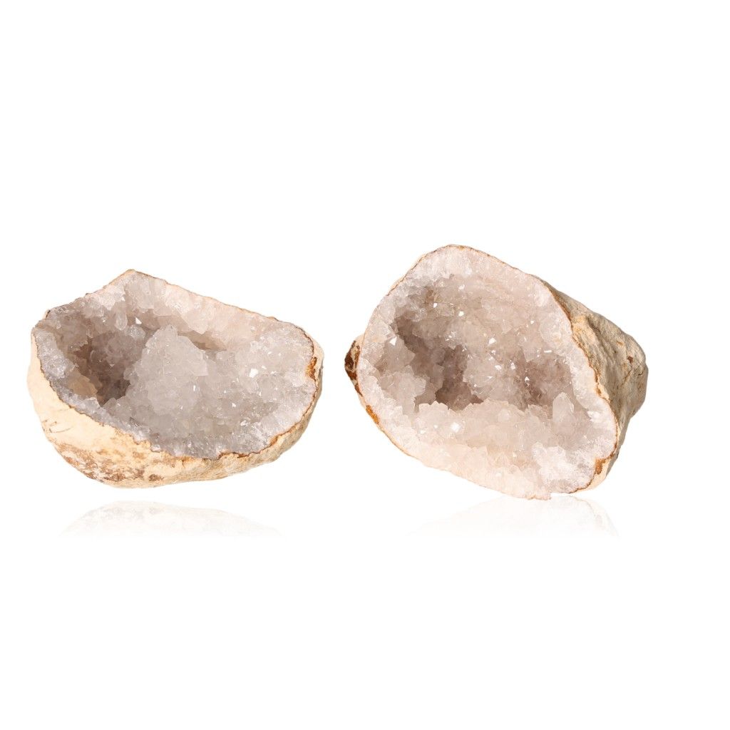 Milky quartz geode with sparkling white crystals, known for enhancing tranquility and clarity, perfect for cleansing and balancing energy.