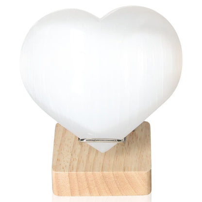 Selenite heart crystal on wooden stand, 12cm, by Sylvia Crystals for spiritual growth and mindful living.