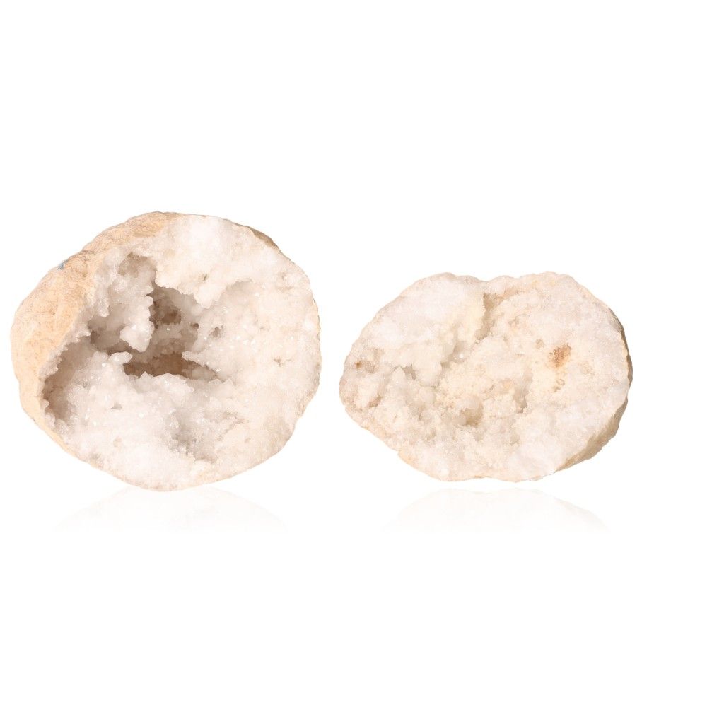 Milky quartz geodes with sparkling white crystals and an earthy outer shell for purification and energy balance.