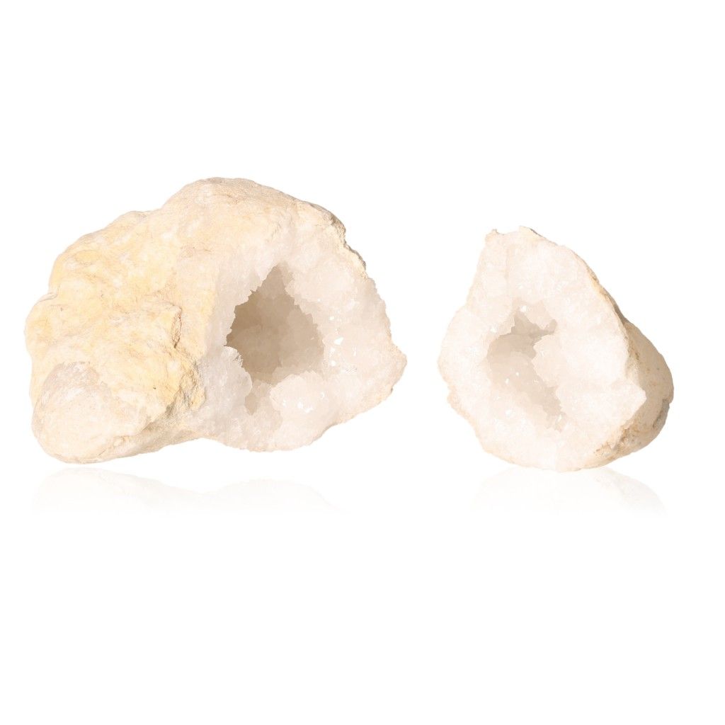 Milky quartz geodes displaying rugged shells with sparkling white crystals, ideal for energy purification and inviting positive vibes.