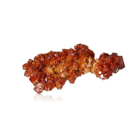 Vibrant reddish-orange Vanadinite Druze with hexagonal crystals on a glassy surface, enhancing focus and motivation.