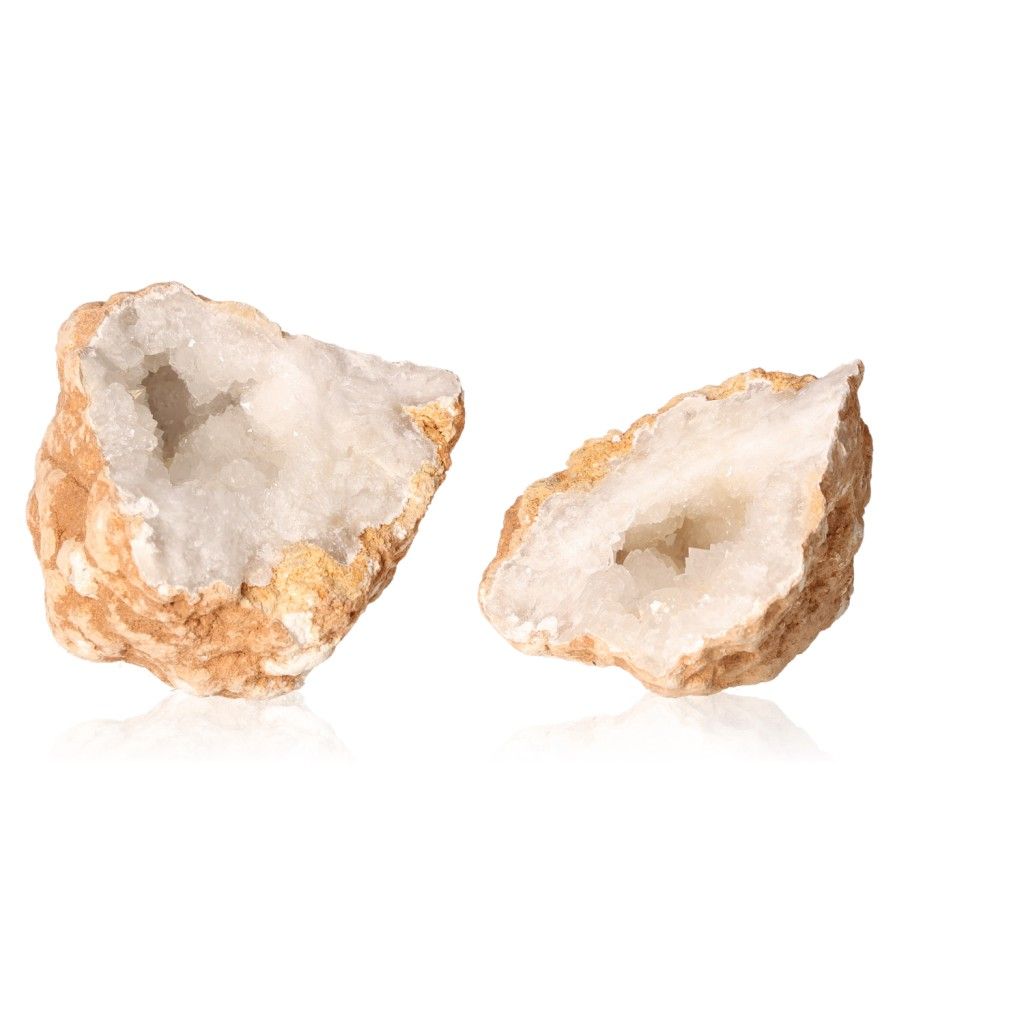 Milky quartz geodes with rugged outer shells and sparkling white crystals, ideal for cleansing spaces and enhancing focus and clarity.