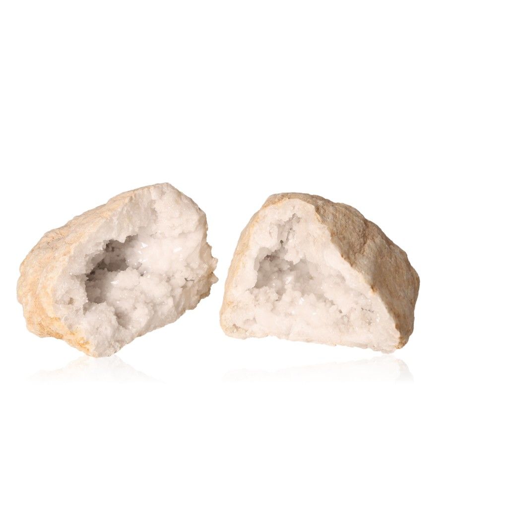 Two halves of a milky quartz geode showcasing sparkling cloudy crystals inside, ideal for energy cleansing and promoting focus.