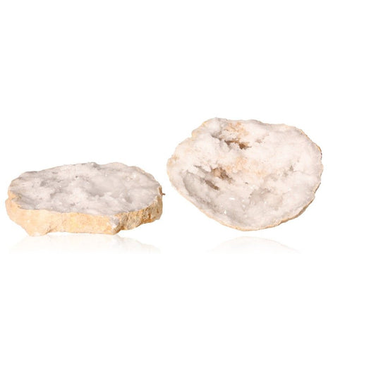 Quartz geode halves revealing sparkling white crystals and rugged shell, ideal for energy cleansing and enhancing tranquility.