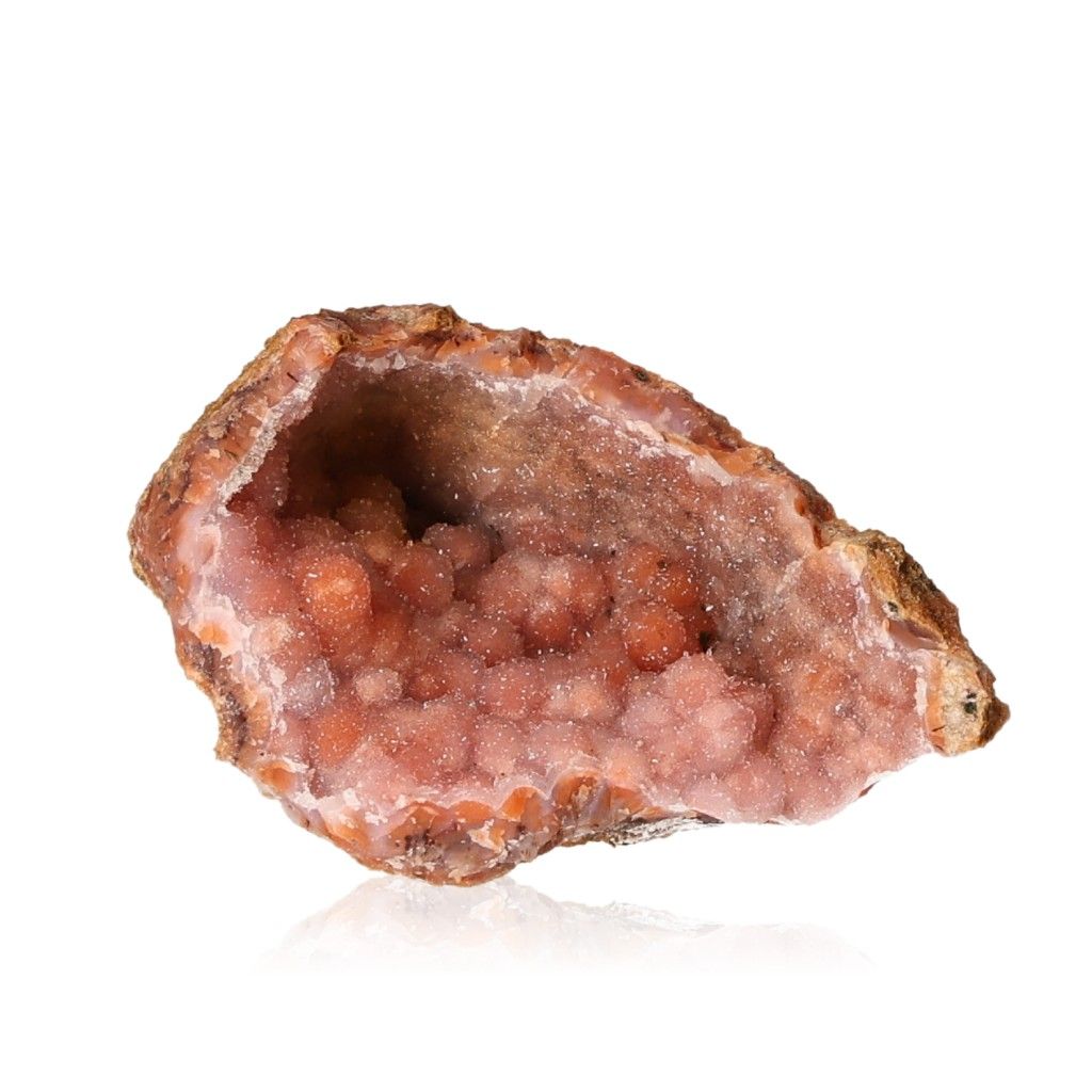 Pink calcite stalactite geode showcasing intricate formations and natural beauty.