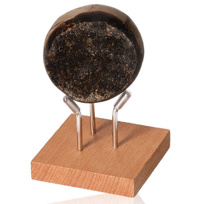 Septarian Dragon Stone sphere on wooden stand showcasing unique mineral texture