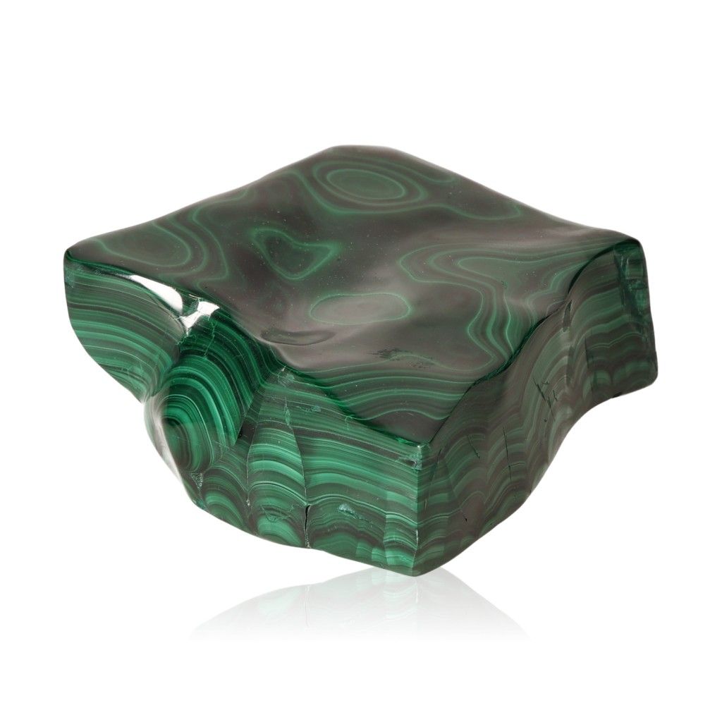 Malachite stone with swirling green patterns, known for its soothing energy and ability to foster courage and a positive attitude.